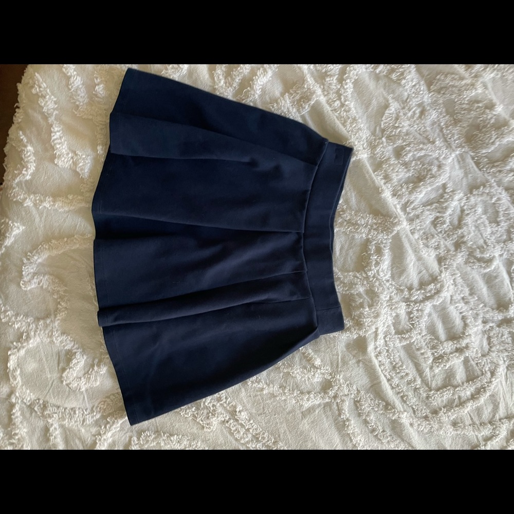 Navy blue pleated mini skirt